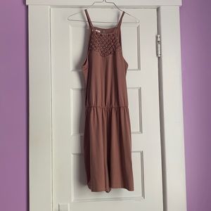 We have a Off colored pink romper. No tags. Still new